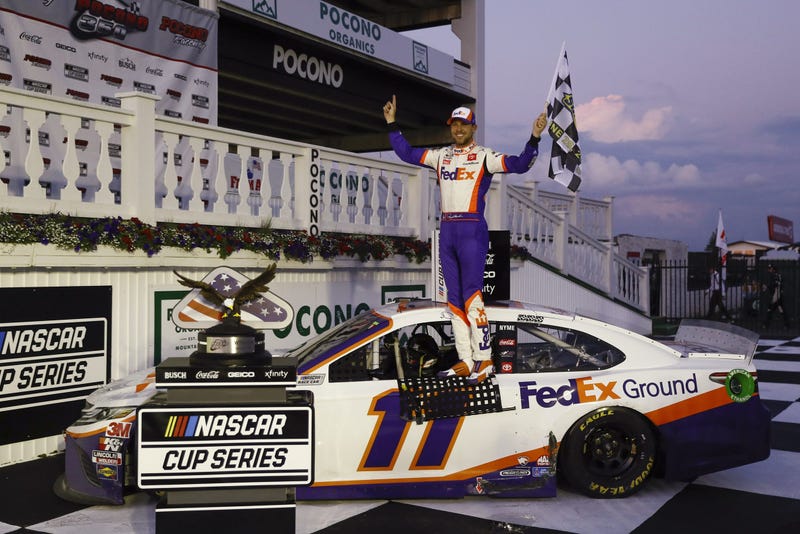 Jun 28, 2020; Long Pond, Pennsylvania, USA; Denny Hamlin celebrates in victory lane after winning the Pocono 350 Cup Series at Pocono Raceway. 