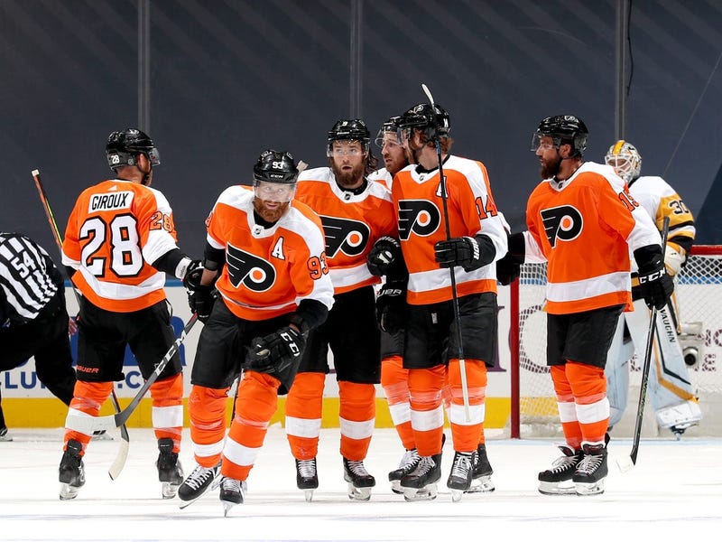 Jakub Voracek #93 of the Philadelphia Flyers celebrates a goal by teammate Sean Couturier #14