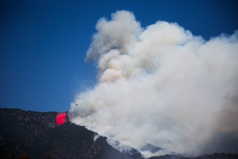 An air tanker drops retardant in Banning, Calif. as the Apple Fire burns on Sunday, August 2, 2020.