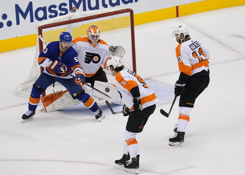 Philadelphia Flyers goaltender Brian Elliott (37) defends the goal as New York Islanders center Casey Cizikas (53) is in position for the rebound