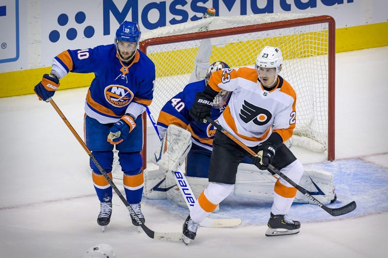 Philadelphia Flyers left wing Oskar Lindblom (23) screens New York Islanders goaltender Semyon Varlamov (40) as center Derick Brassard (10) defends during game six of the second round of the 2020 Stanley Cup Playoffs at Scotiabank Arena.