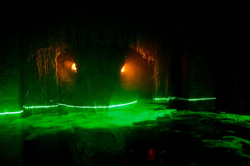 A movable Crocodile sits in a cave as fog hits lasers to look like water in a room at The Slaughterhouse, a 20,000 square foot haunted house in Downtown Des Moines on Friday, Sept. 4, 2020 in Des Moines. The attraction opens on October 2 with timed entrie