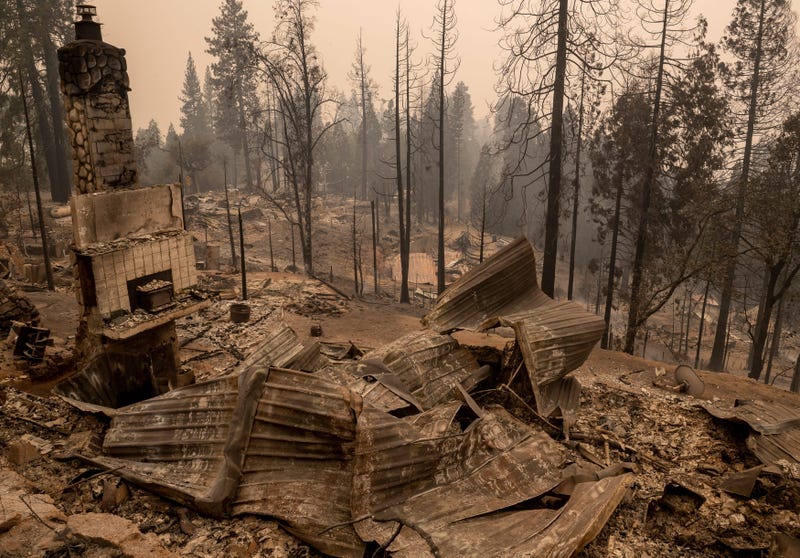 Remnants of homes, cars, bicycles and street signs litter the path left by the Creek Fire in Big Creek, Calif., on Tuesday, Sep. 8, 2020.