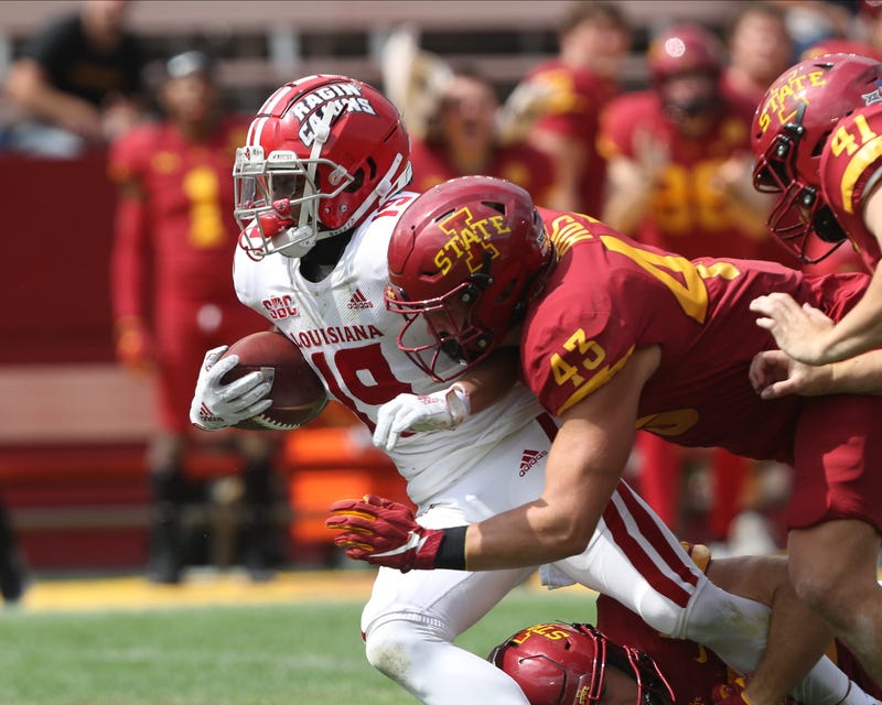 Sep 12, 2020; Ames, Iowa, USA; Louisiana-Lafayette Ragin Cajuns wide receiver Jamal Bell (19) is tackled by Iowa State Cyclones linebacker Dae'Shawn Davis (43) at Jack Trice Stadium. The Ragin Cajuns beat the Cyclones 31 to 14.