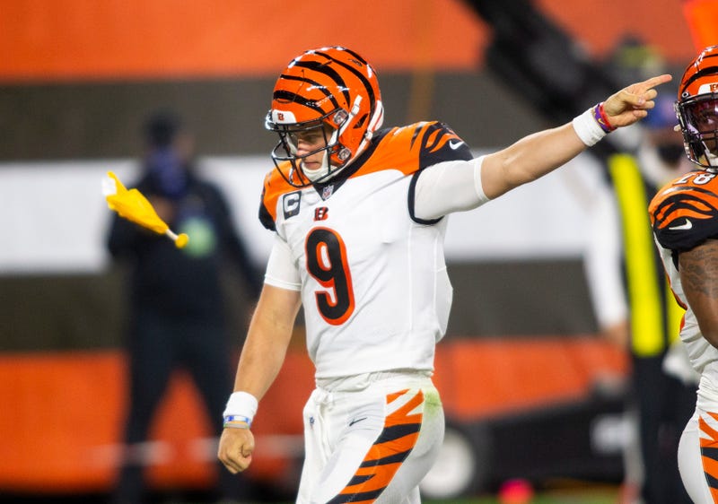 Sep 17, 2020; Cleveland, Ohio, USA; Cincinnati Bengals quarterback Joe Burrow (9) signals to the Cleveland Browns for an encroachment penalty as a flag is thrown during the third quarter at FirstEnergy Stadium. Mandatory Credit: Scott Galvin-USA TODAY Spo