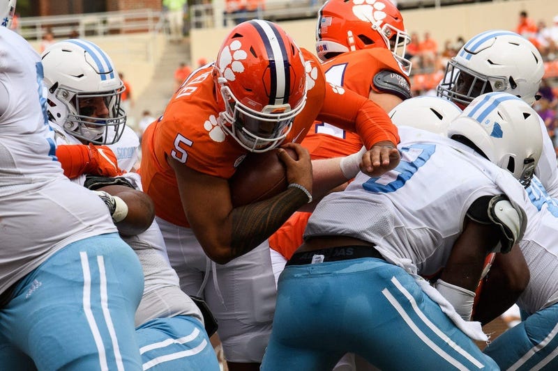 Clemson quarterback D.J. Uiagalelei (5) pushes past The Citadel defense to score a touchdown during the second quarter of their game Saturday, Sept. 19, 2020.