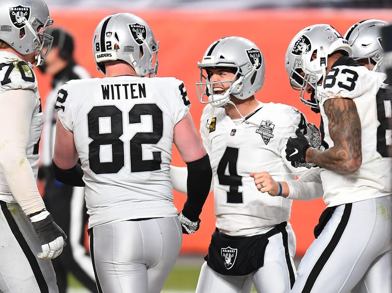 Raiders quarterback Derek Carr (4) and tight end Jason Witten (82) and tight end Darren Waller (83) celebrate a two point conversation in the fourth quarter against the Denver Broncos at Empower Field at Mile High