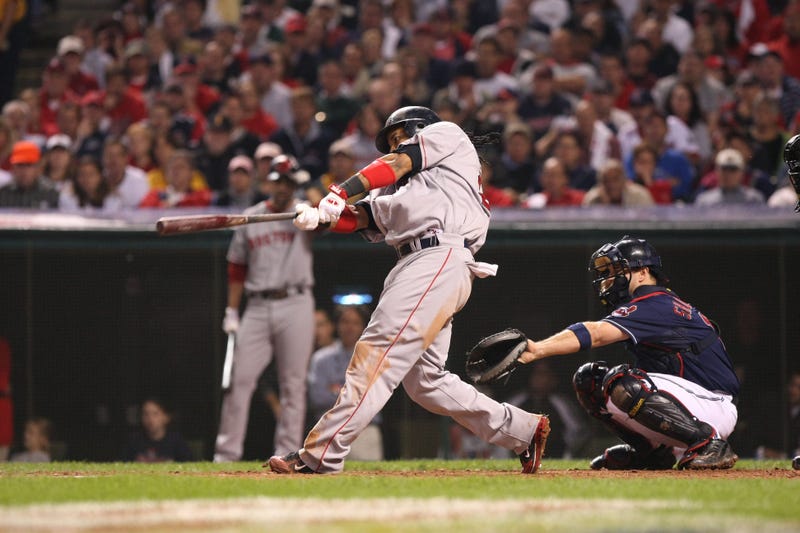 Boston Red Sox left fielder (24) Manny Ramirez hits a home run in the 6th inning against the Cleveland Indians during game 4 of the 2007 American League Championship Series at Jacobs Field. 