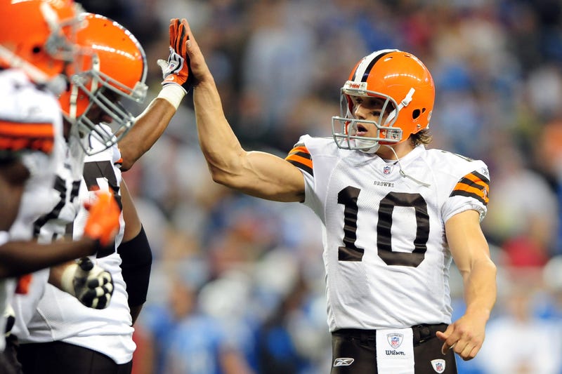 Brady Quinn high fives teammates after a TD