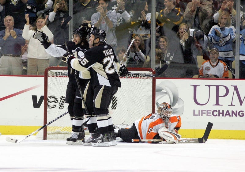 Pittsburgh Penguins Kris Letang (58) and Max Talbot (25) celebrate scoring in front of Philadelphia Flyers goalie Sergei Bobrovsky (35) during the first period at the CONSOL Energy Center.