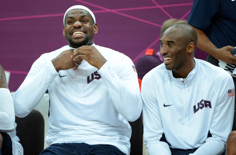 Aug 2, 2012; London, United Kingdom; United States players LeBron James (left) and Kobe Bryant react during the preliminary game against Nigeria in the London 2012 Olympic Games at Basketball Arena. The United States defeated Nigeria 156-73. Mandatory Cre
