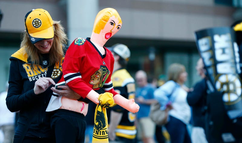 Jun 19, 2013; Boston, MA, USA; Boston Bruins fan Maryellen Cahill holds an inflatable doll wearing a Chicago Blackhawks jersey before game four of the 2013 Stanley Cup Final at TD Garden. Mandatory Credit: Greg M. Cooper-USA TODAY Sports