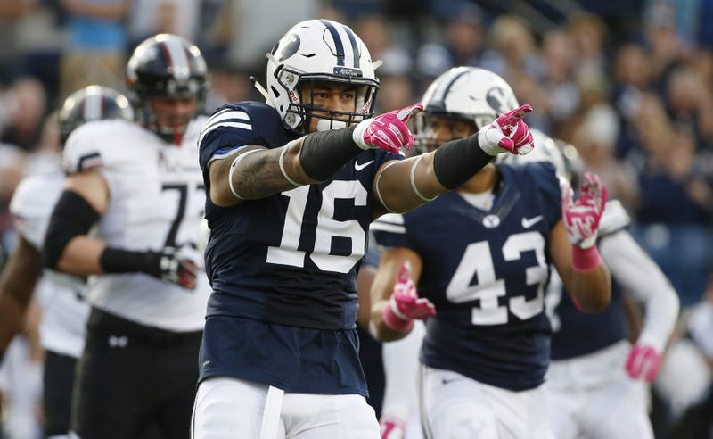 Brigham Young Cougars linebacker Sione Takitaki (16) reacts after making a tackle for no gain against the Cincinnati Bearcats in the first quarter at Lavell Edwards Stadium. 