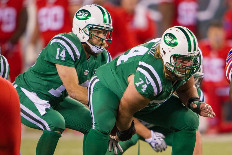 Nick Mangold hikes the ball to New York Jets quarterback Ryan Fitzpatrick in the second half at MetLife Stadium.
