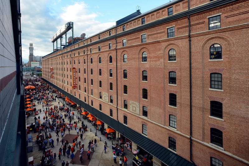 Fans walk down Eutaw Street at Oriole Park