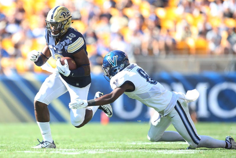 Pittsburgh Panthers wide receiver Dontez Ford runs after a pass reception against Villanova Wildcats defensive back Trey Johnson. Johnson sued the NCAA Wednesday over student athlete pay.