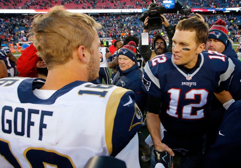 New England Patriots quarterback Tom Brady (12) is congratulated by Los Angeles Rams quarterback Jared Goff 