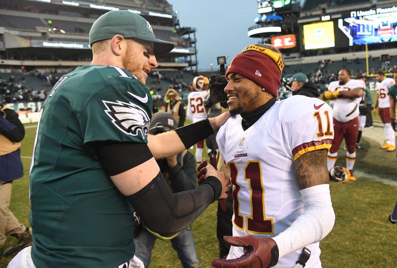Philadelphia Eagles quarterback Carson Wentz speaks with Washington Redskins wide receiver DeSean Jackson.