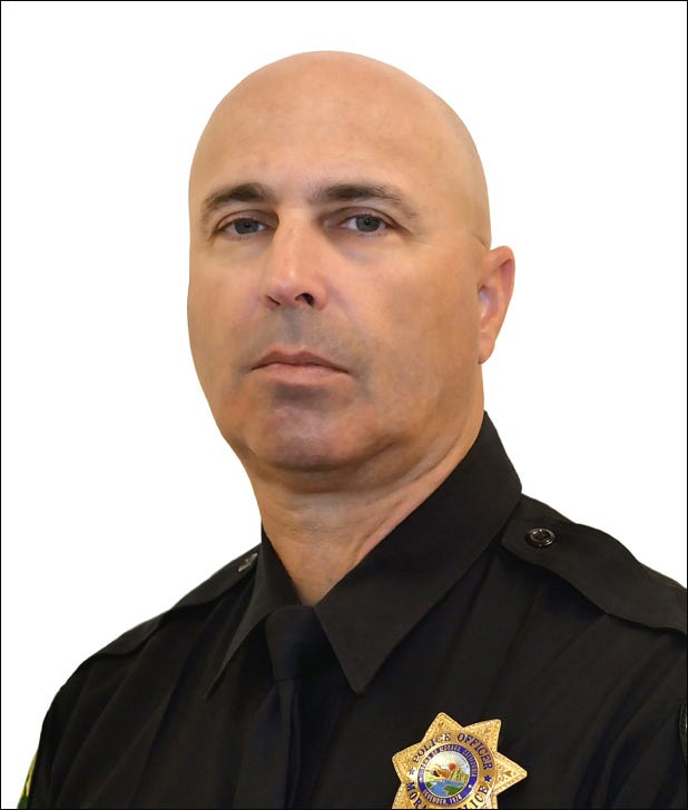 A well-respected Moraga police corporal now lies at a cemetry in Lafayette following a Wednesday afternoon procession of dozens of law enforcement officers through three Contra Costa County community. 