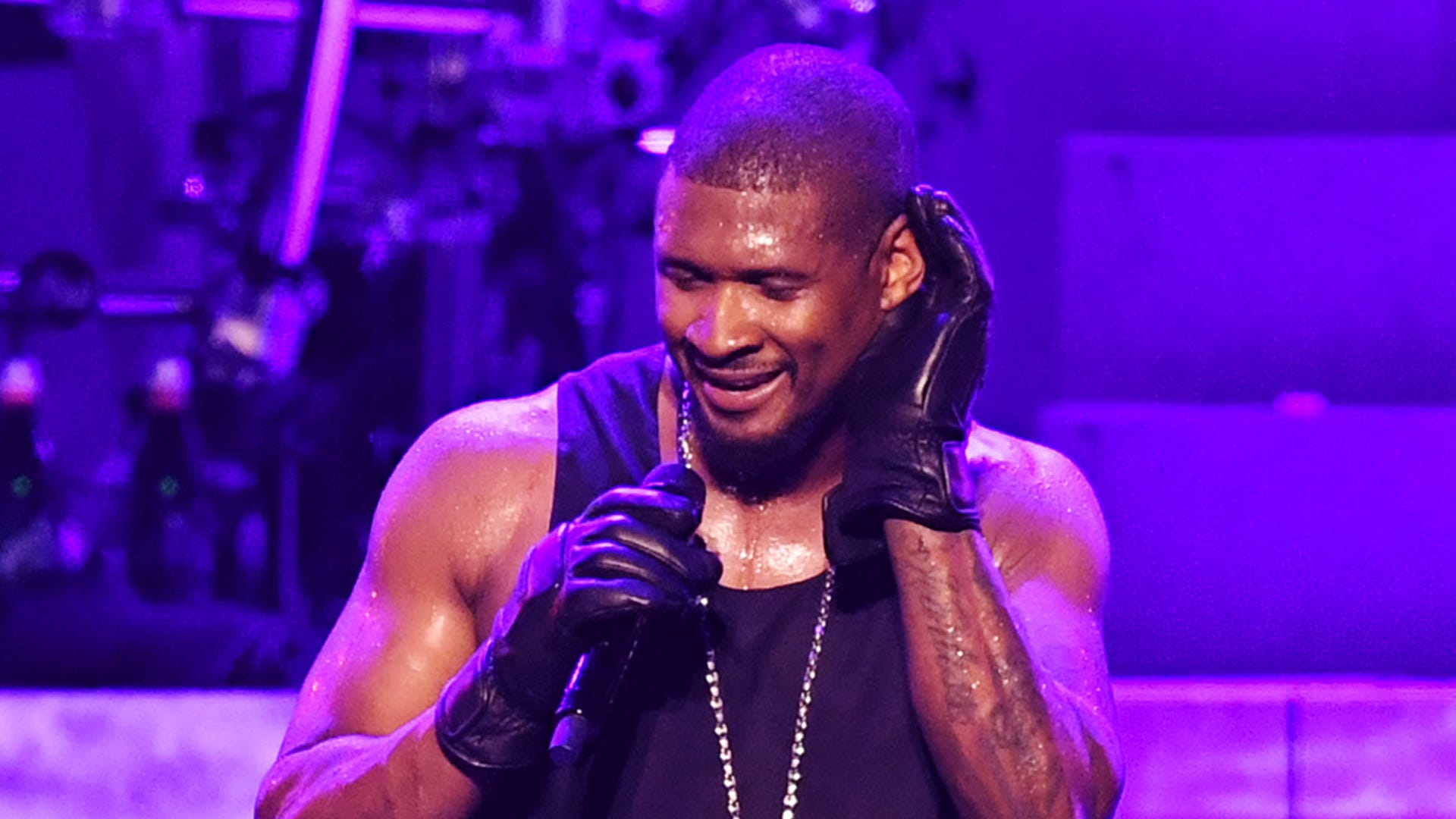 Usher forced to reschedule several shows because of neck injury