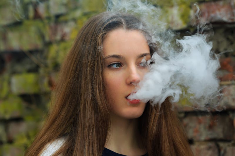 Woman Using Vaping Device