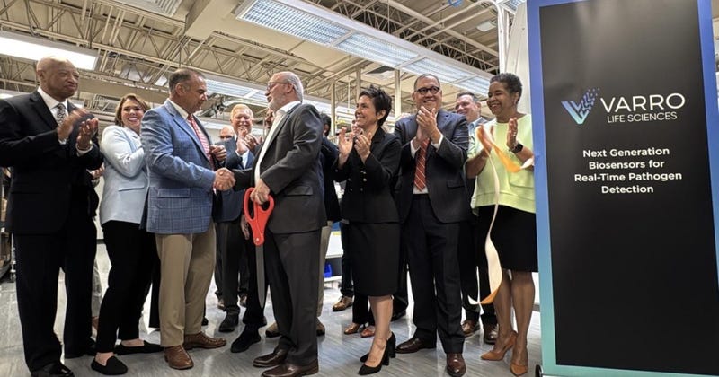 Officials including Mayor Cara Spencer and Governor Mike Kehoe cut the ribbon on the new home of Varro Life Sciences in St. Louis' Cortex Innovation Community.