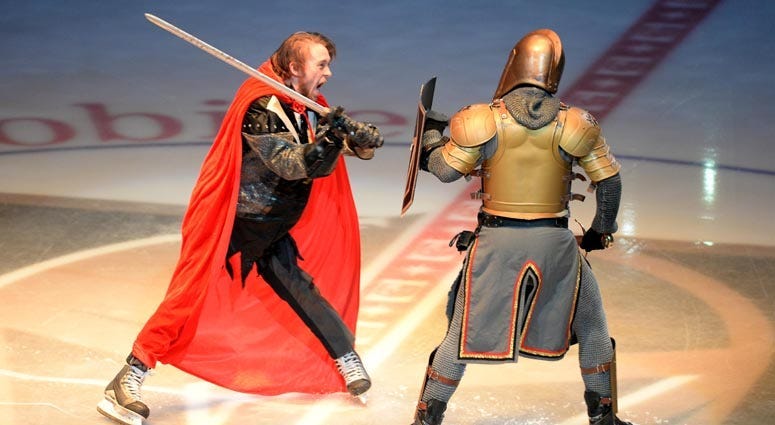 The Vegas Golden Knights' mascot duels the Washington Capitals' mascot before Game 1 of the 2018 Stanley Cup Final on May 28, 2018, at T-Mobile Arena in Las Vegas.