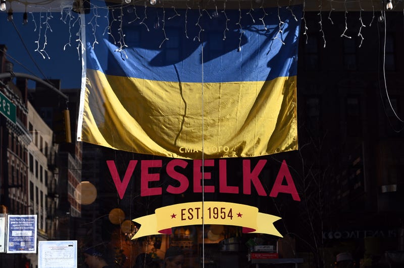A Ukrainian flag hangs in the widow of Veselka restaurant, the Ukrainian eatery in Manhattan’s East Village, New York, NY, February 28, 2022