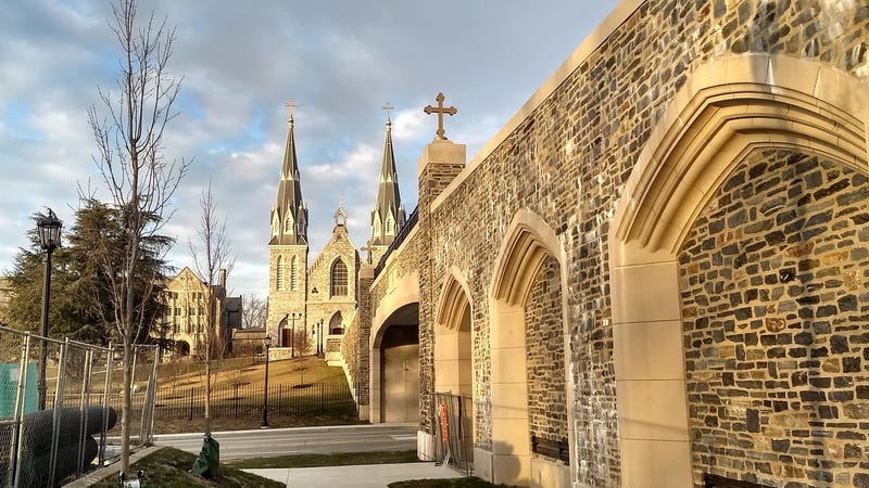 The sun sets over Saint Thomas of Villanova Church.