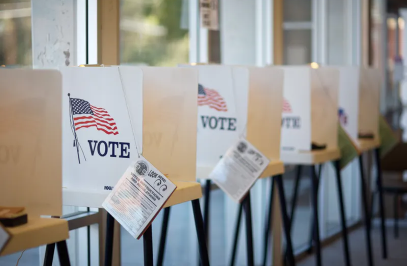 Voting booths with American flag images