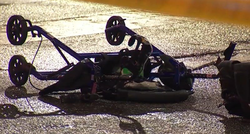 A walker lying in the street after a hit-and-run