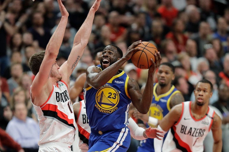 Warriors guard Stephen Curry celebrates with teammates during the fourth quarter against the Cleveland Cavaliers in Game 3 of the NBA Finals on June 6, 2018, at Quicken Loans Arena.