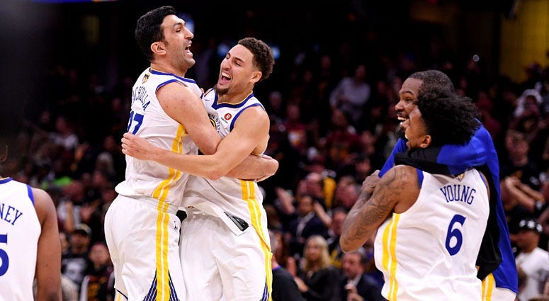 Golden State Warriors center Zaza Pachulia (left) celebrates with teammate Klay Thompson (11) after beating the Cleveland Cavaliers in Game 4 of the NBA Finals at Quicken Loans Arena in Cleveland.