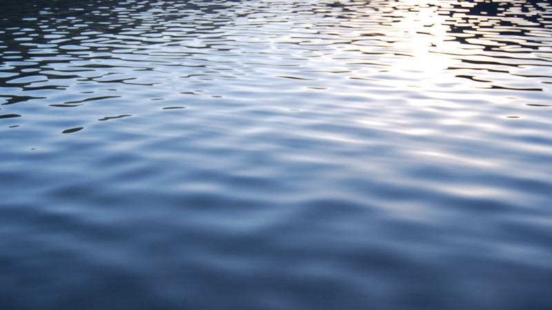 Small lake ripples and soft sunshine reflections