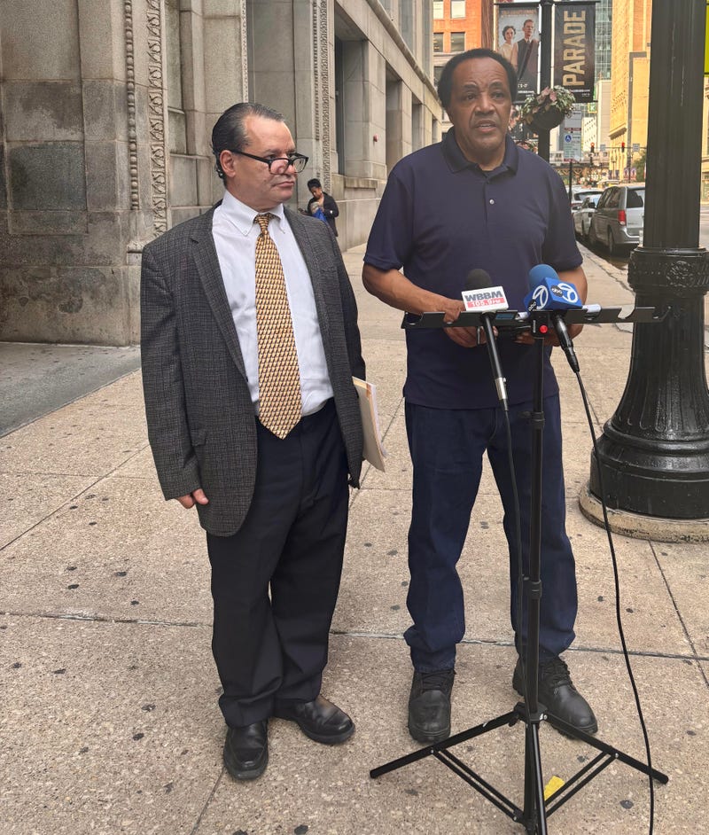 David Sanchez and Activist Andrew Holmes gather outside City Hall