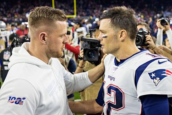 J.J. Watt and Tom Brady after a game.