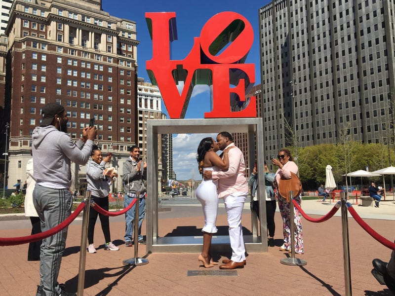 Ikea Faust and Kuzell Bivins get married in Love Park.