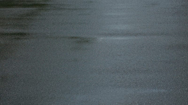 Gray texture of wet asphalt on the road - stock photo