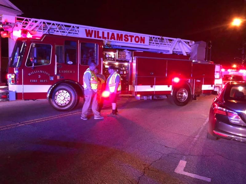 Fire fighters from Williamston Fire Department on the scene of a pedestrian struck on Main Street in Williamston.