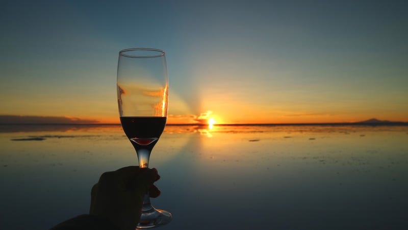 Cheers to the gorgeous sunset on the mirror effect of Uyuni Salt Flats, Bolivia, South America