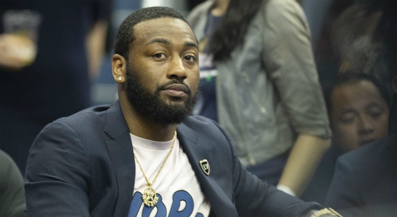 Wizards PG John Wall on the bench