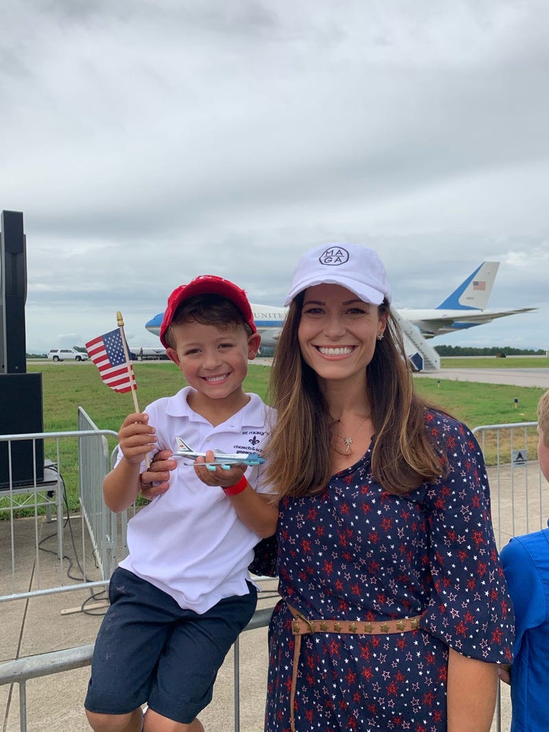 Woman and Child Await Trump at GSP