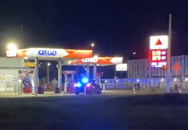 Scene of a woman run over by a car at a gas station in Detroit.
