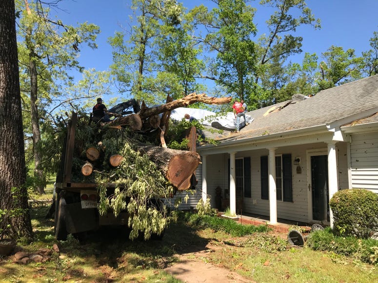 Workers Remove Debris Off Home in Seneca