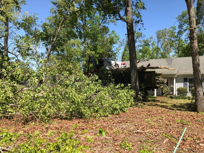 Workers Remove Debris Off Seneca Home