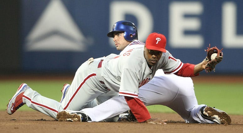 The Mets' David Wright is tagged trying to steal second by Jimmy Rollins of the Philadelphia Phillies on May 6, 2009, at Citi Field.