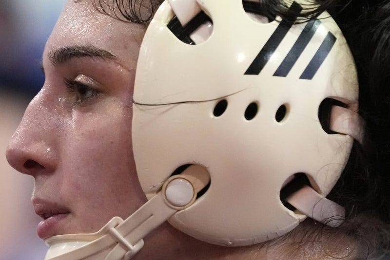 Woman wrestler with head gear