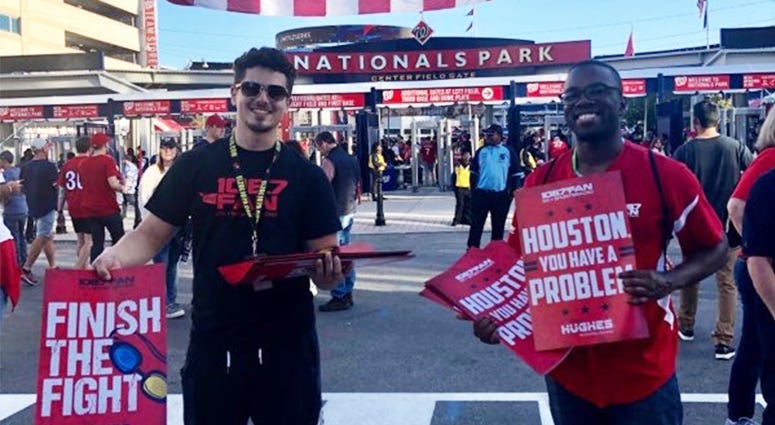 "Finish the Fight" cards were handed out to baseball fans before Game 5 of the World Series outside Nats Park.