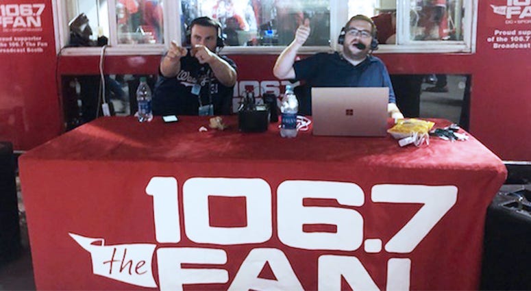Danny Rouhier (L) and Grant Paulsen (R) of 106.7 The Fan broadcasting live before Nationals-Astros Game 5 at Nats Park.