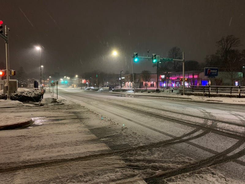 Snow overnight has left Wynnewood Avenue, near the train station, slick but passable.